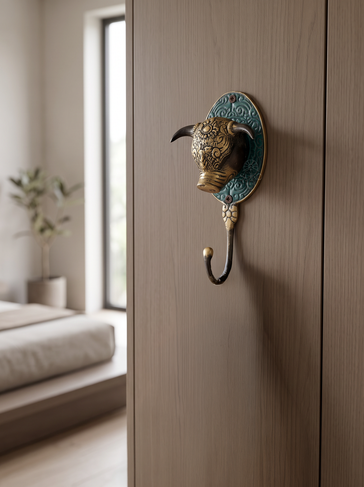 Brass bull head wall hook on embossed turquoise backplate