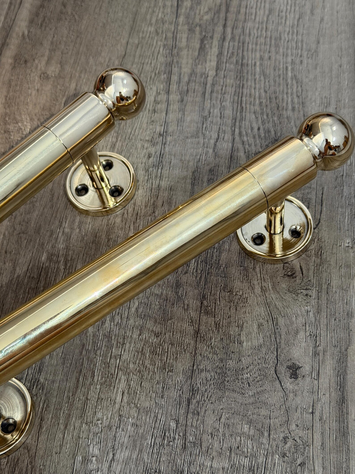 Architectural brass door hardware with clean silhouette