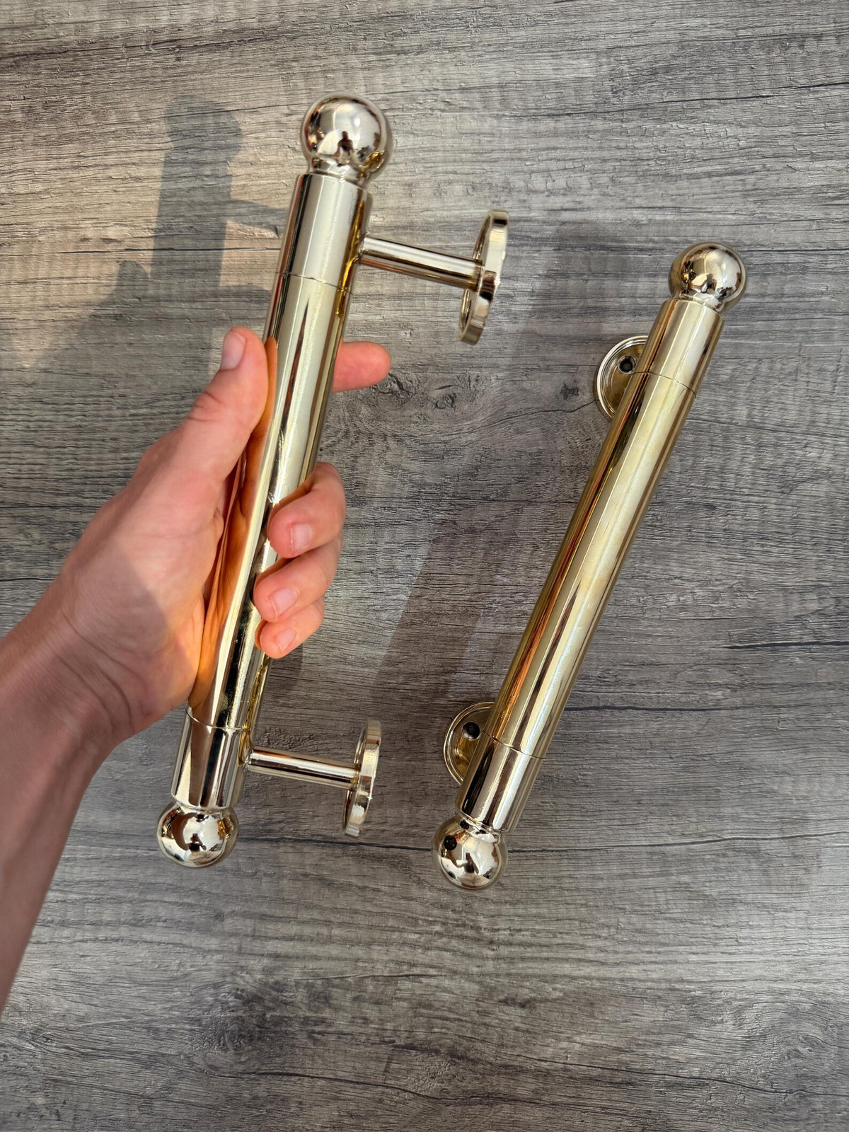 Brass door pull handle with rounded finials for entry doors