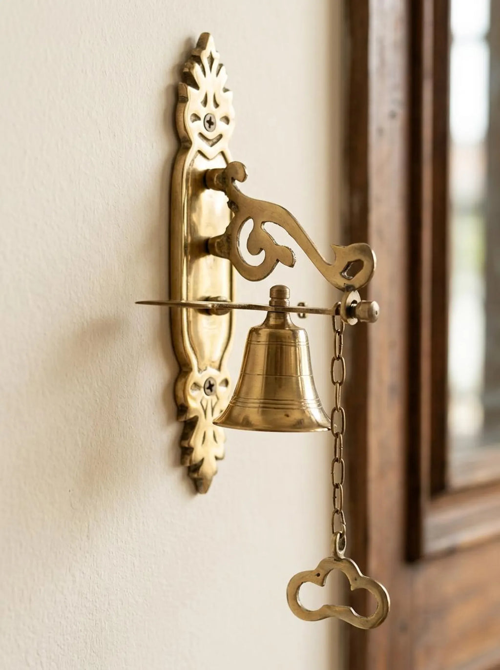 Vintage-inspired solid brass door bell with mechanical lever and pull chain