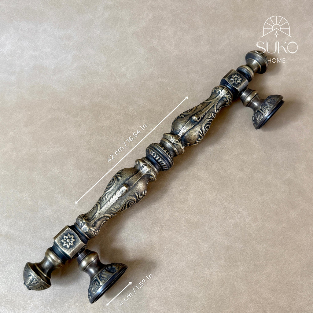Ornate brass door pull with dimensions: 42 cm length and 4 cm round mounting plates