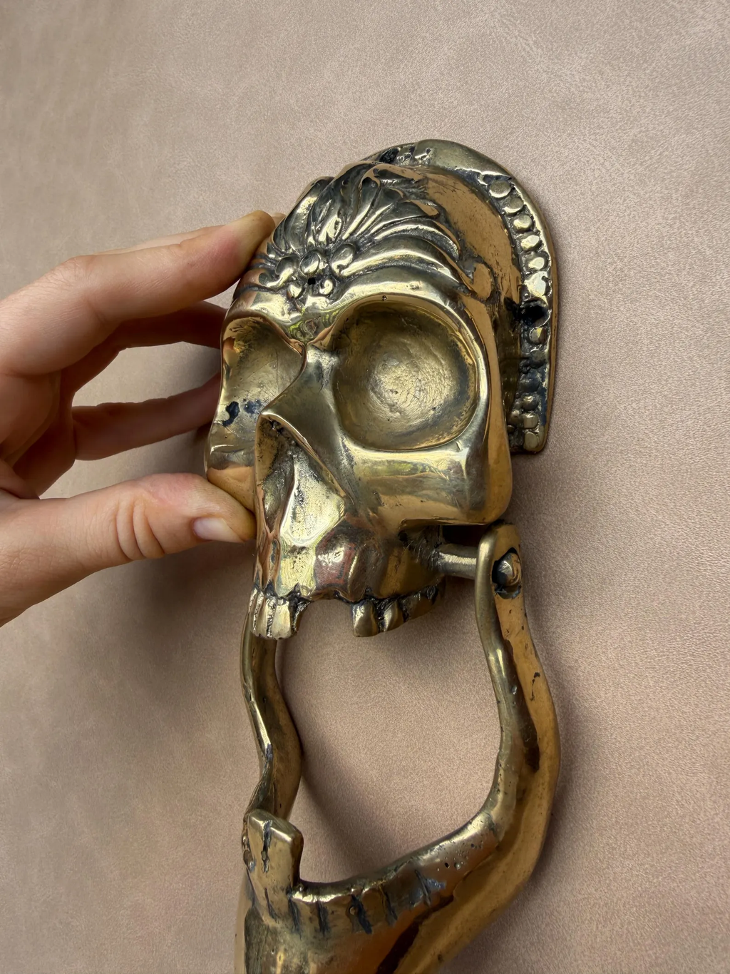 Year round gothic door decor with brass skull knocker